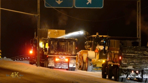 Snowplow video 11 - Convoy of snow dump trucks follow blower in big...