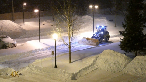 Snowplow video 9 - John Deere loader plowing condo driveway during...