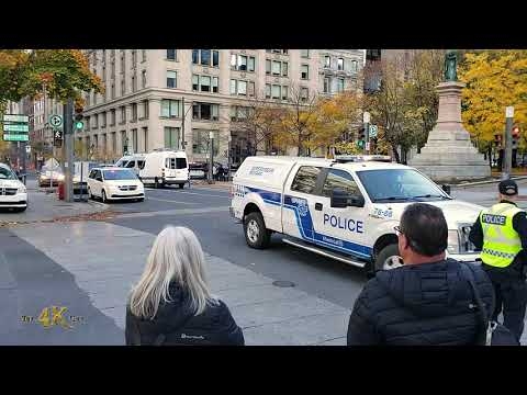 Montréal: Police motorcade escorting US dignitary passing downtown...