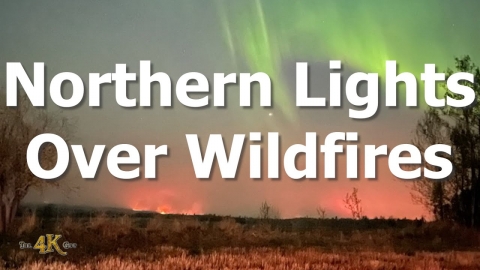 Canada: Aurora borealis appear over night time glow of forest fire 5-5-2023